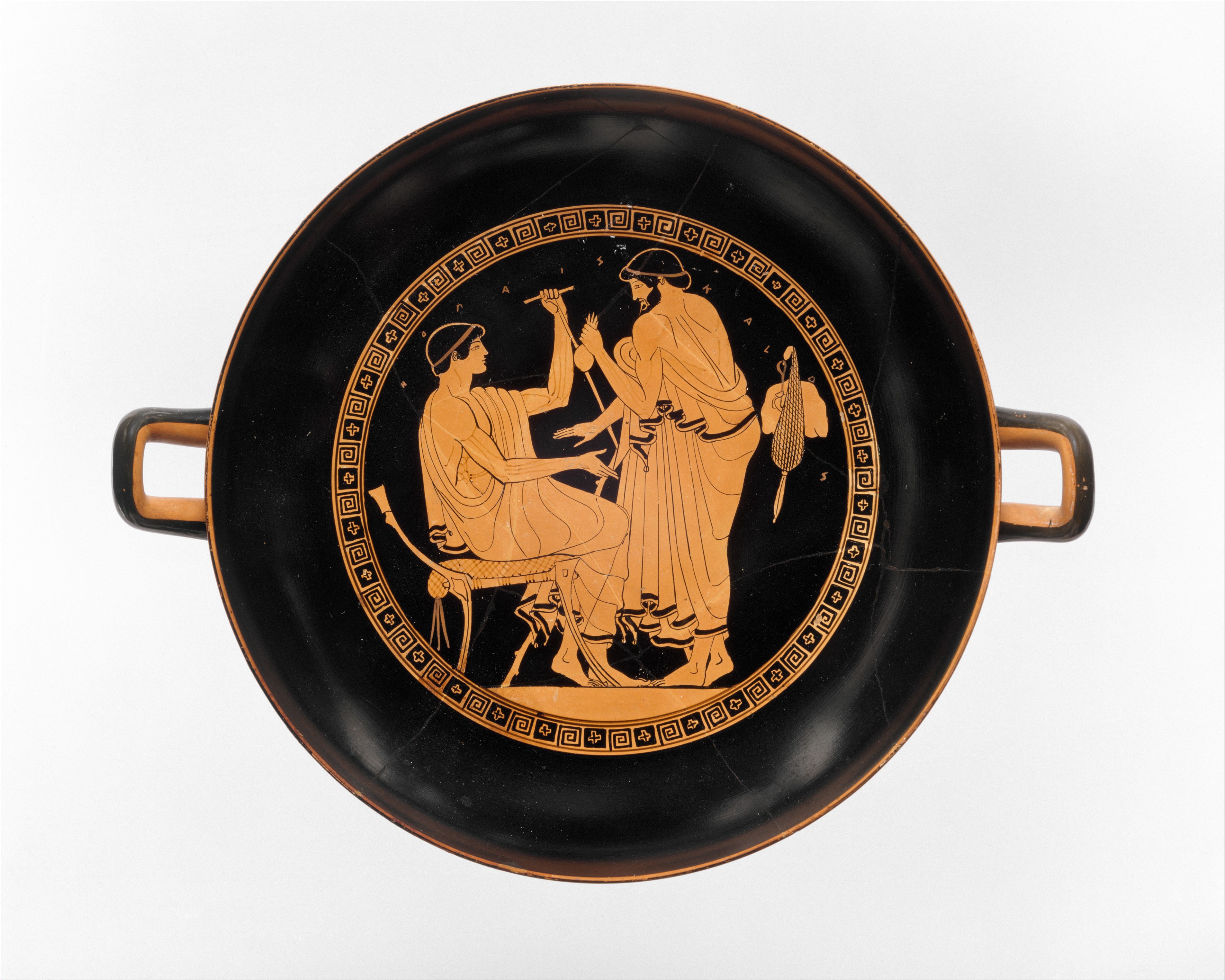 Men wearing himatia. Kylix of Douris, 480-470 BC. Metropolitan Museum (Public domain) | www.artextiles.org