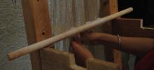Weaving on the warp-weighted loom. Photo S. Spantidaki.